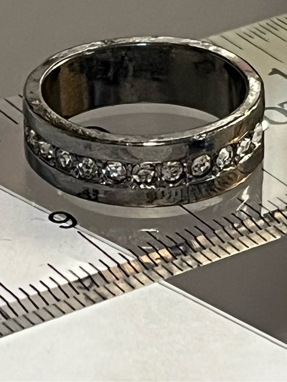 Thick silver band ring with diamond accent